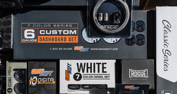 GlowShift gauge sets, apparel, and accessories laid out for a sponsored build